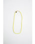 neon yellow and green color block cord necklace with a gold carabiner clasp on a light background