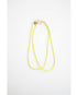 two neon yellow and green color block cord necklaces with a gold carabiner clasp on a light background