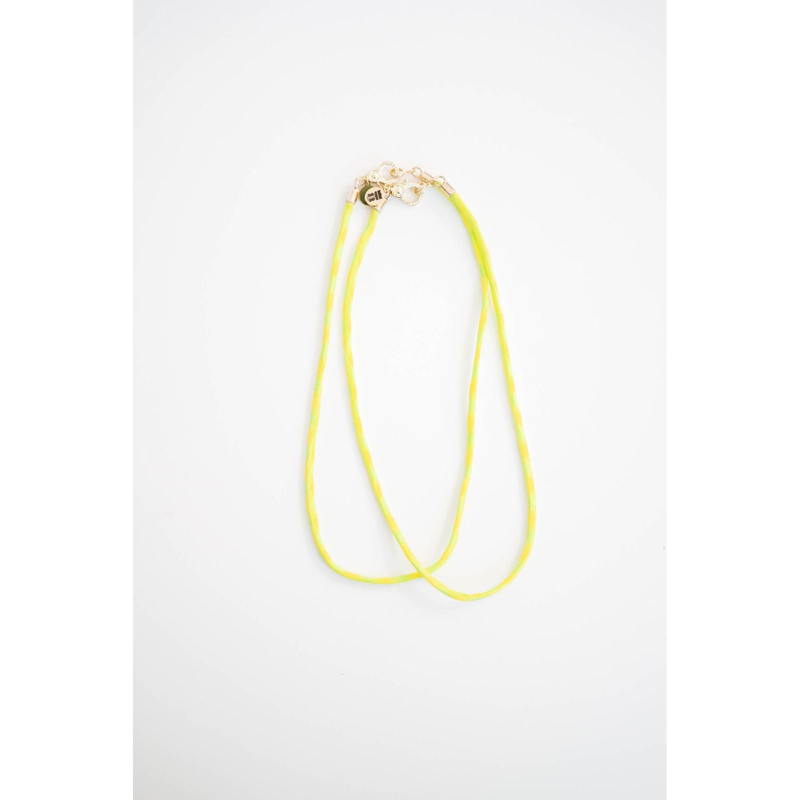 two neon yellow and green color block cord necklaces with a gold carabiner clasp on a light background