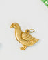 vintage goose-shaped gold/brass charm on a light background