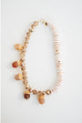 Bracelet with acorn-shaped beads on a white background
