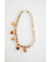 Bracelet with acorn-shaped beads on a white background