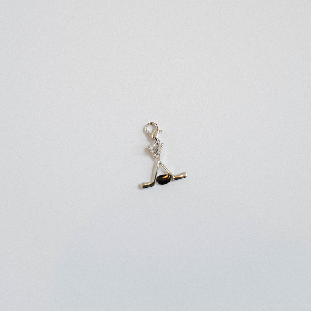 Hockey Sticks & Puck Charm