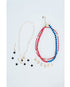 white star Necklace with 'HOCKEY' spelled out in charms and red white and blue beaded strands on a light gray background