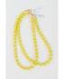 two neon yellow beaded necklaces with glass roller beads in between and a gold pave clasp