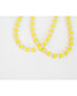 two neon yellow beaded necklaces with glass roller beads in between and a gold pave clasp