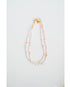 Colorful beaded necklace on a white background