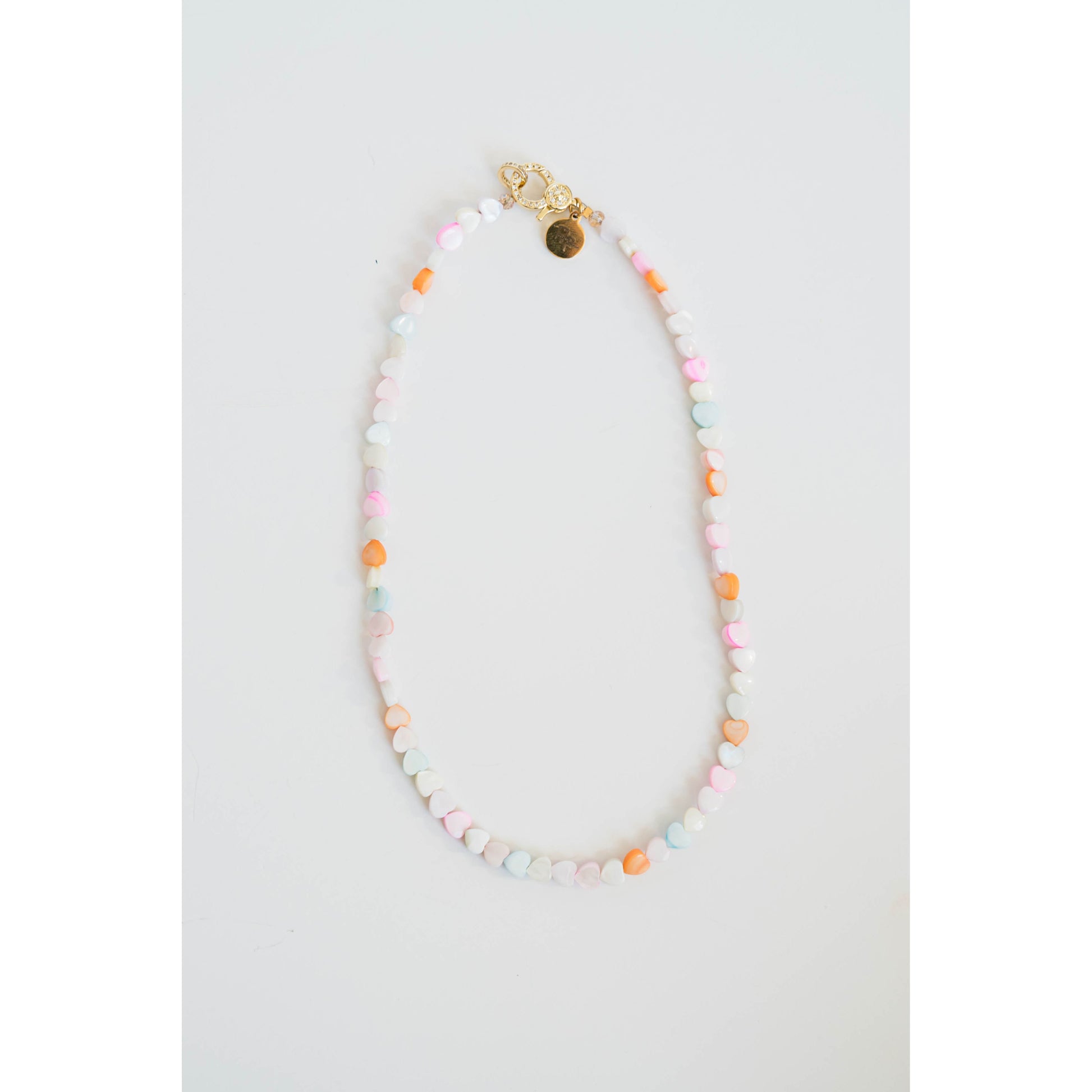 Colorful beaded necklace on a white background