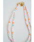 two colorful necklaces of pastel colored heart beads with gold clasps