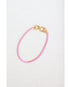 light pink box chain bracelet with a gold pave lever clasp on a light grey background