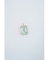 Rectangular light blue gemstone pendant in a gold frame on a white background