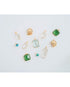 Collection of various gemstone pendants in light blue, crystal, and green on a light gray background