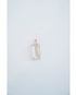 rectangular crystal pendant in a gold frame against a light grey background