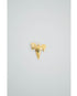 Gold textured shark tooth charm on a light gray background