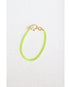 neon yellow enamel box chain bracelet with a gold pave lever clasp on a light grey background
